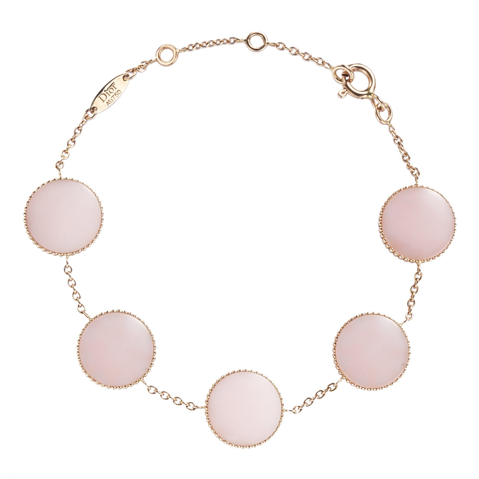 Detailed shot of a Dior Rose des Vents pendant with intricate gemstone settings