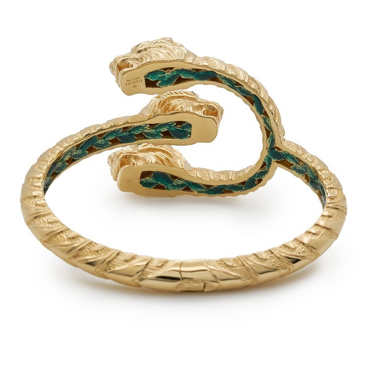 Detailed view of the tiger's eye and tsavorite inlay on the Gucci Dionysus bracelet