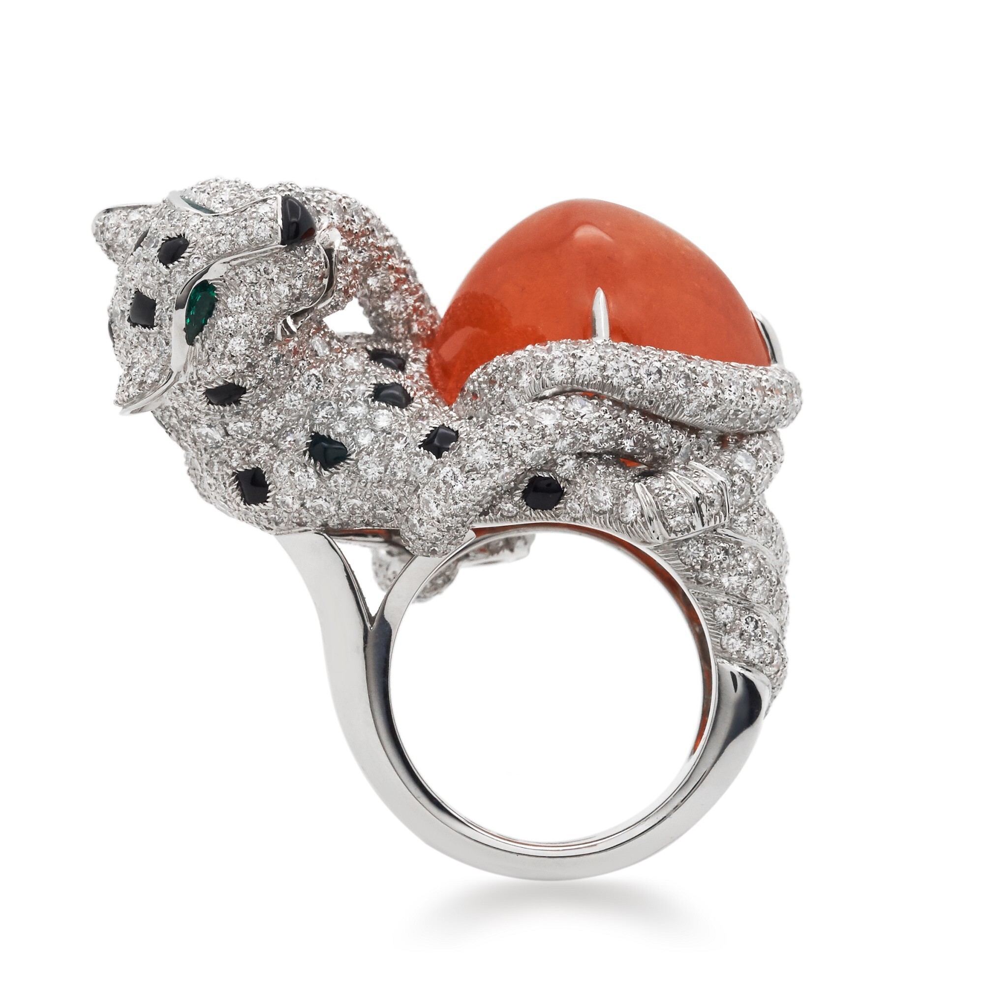 Close-up of the Cartier Cheetah Ring's head, revealing brilliant-cut diamonds and two emerald eyes.
