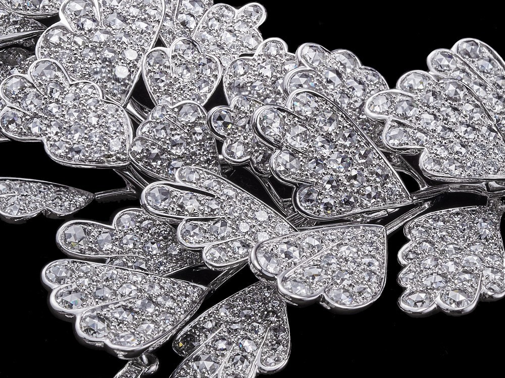 Detailed view of the platinum fern leaf design with brilliant and rose-cut diamonds on the Cartier Adiante necklace