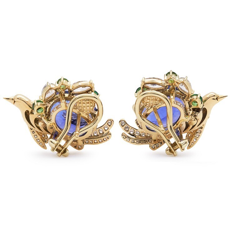 Detailed view of Tiffany & Co. Art of the Wild earrings showcasing oval tanzanite and gold craftsmanship.