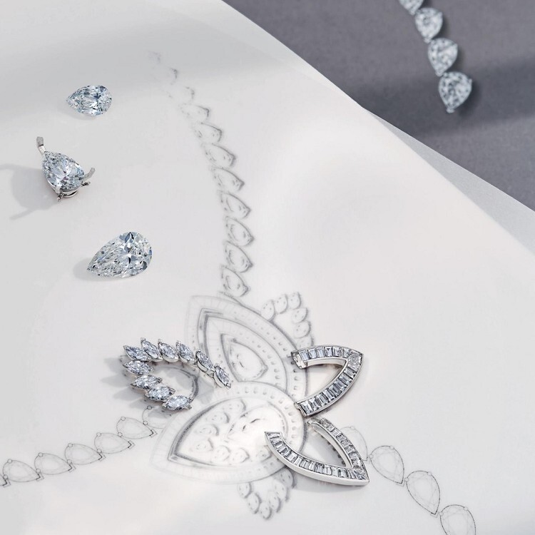 Rear view of the De Beers Blooming Lotus necklace pendant, revealing its clever detachable brooch mechanism