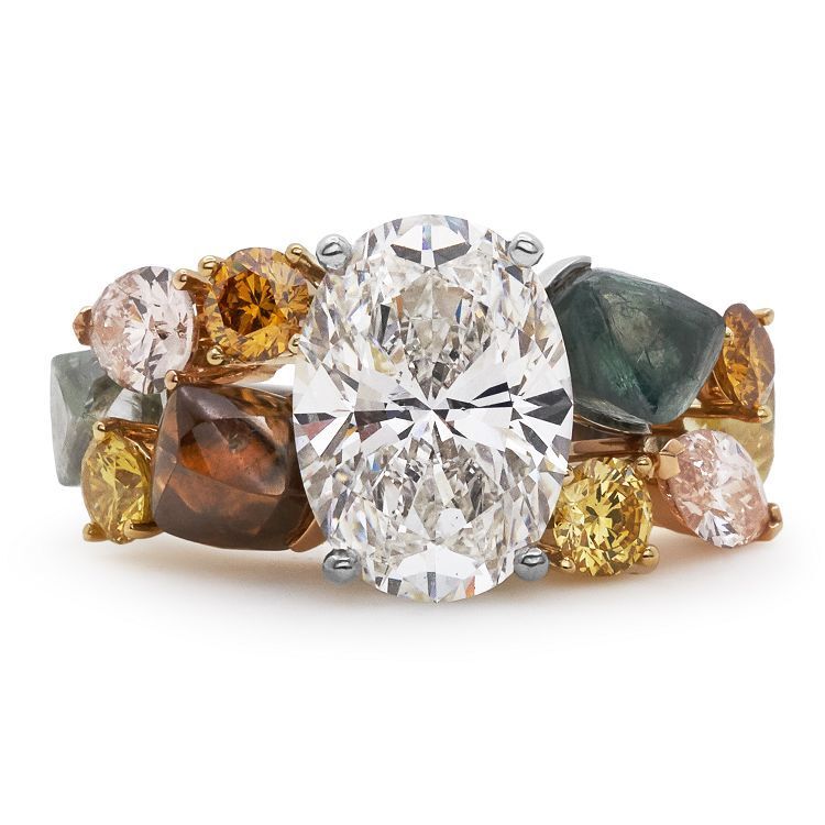 Close-up detail of the De Beers Soothing Lotus ring, showcasing the intricate arrangement of pink and yellow diamonds.