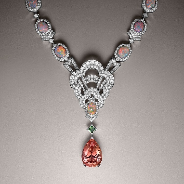 Detailed view of the Louis Vuitton Conquêtes necklace showcasing the imperial topaz, demantoid garnet, and diamond-set motifs.