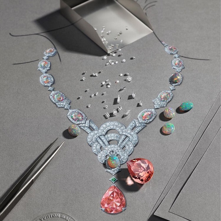Close-up of the pendant on the Louis Vuitton Conquêtes necklace, highlighting the 'V' motif and Monogram flowers.