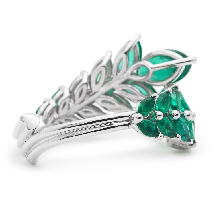 Side profile of the Chopard 'Emerald Palm Leaf' ring showcasing its elegant white gold palm branch design.
