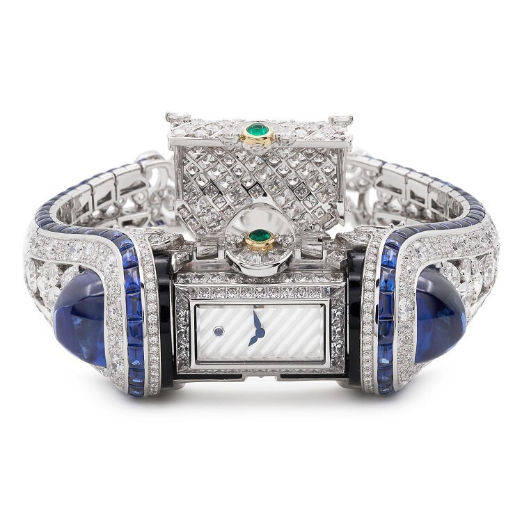 Close-up of the Van Cleef & Arpels Heure Marine watch, highlighting intricate sapphire and diamond settings.