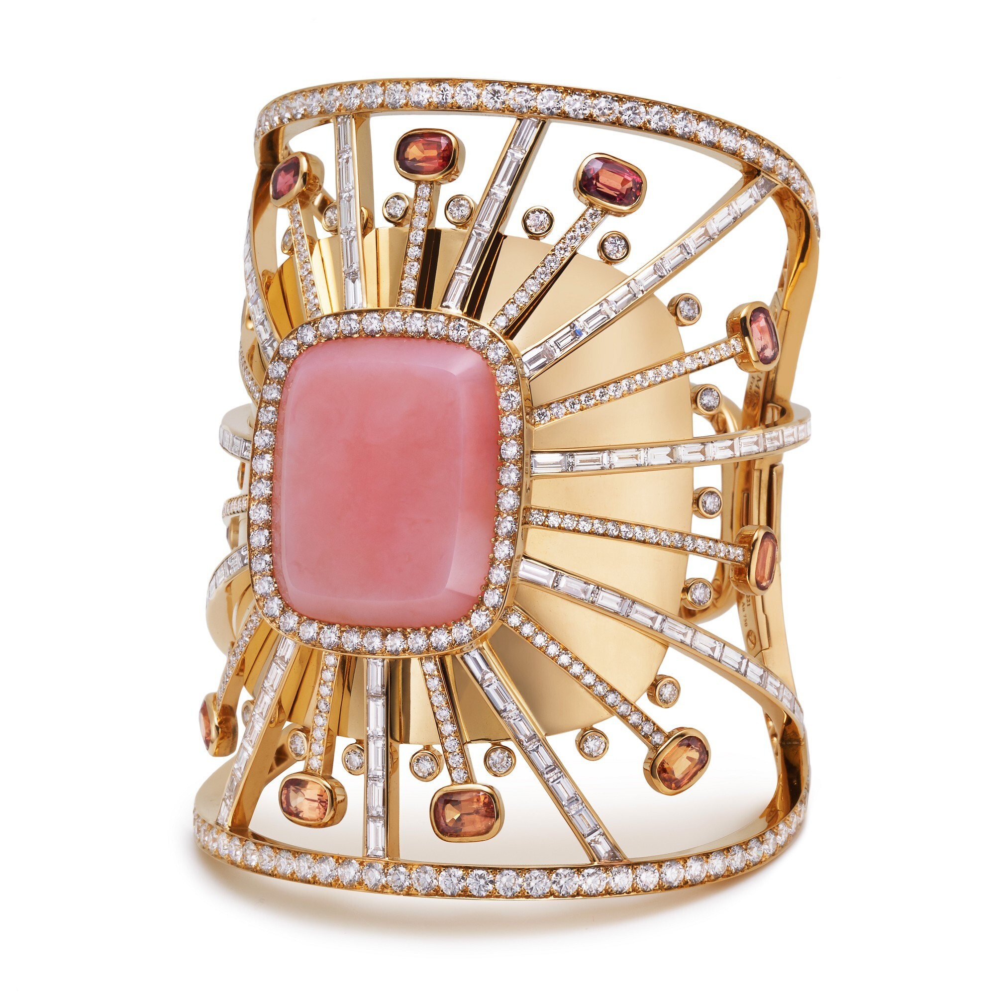 Detailed close-up of the Hermès Attelage Céleste gold ring, highlighting the brilliant pink opal and surrounding diamond arrangement.