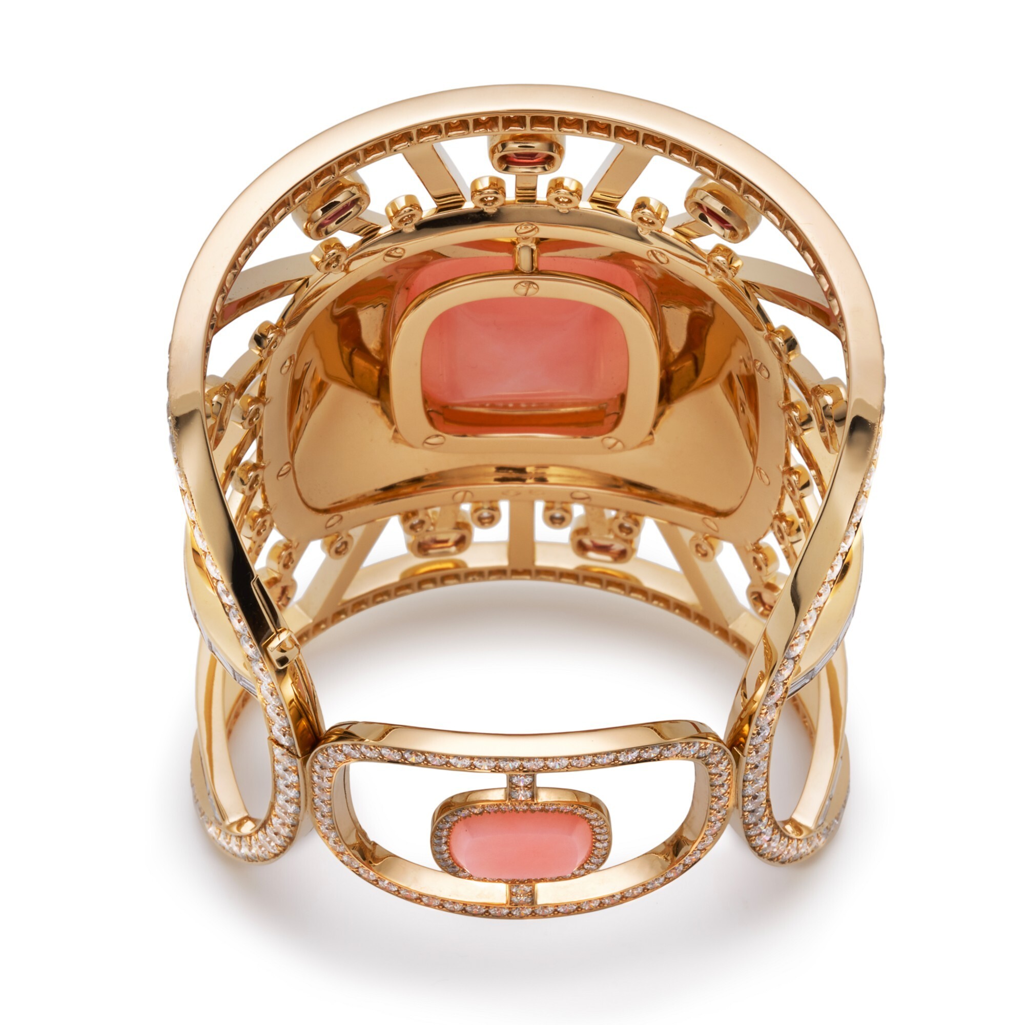 Top-down perspective of the Hermès Attelage Céleste gold ring, with a clear focus on the captivating central pink opal.