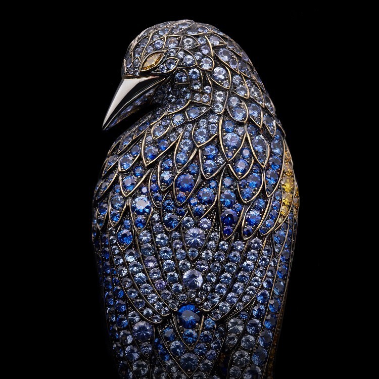 Detailed view of the Tiffany Feathered Cloak Brooch's tail, featuring luminous pear-shaped diamonds and deep blue sapphires, accentuating its graceful form.