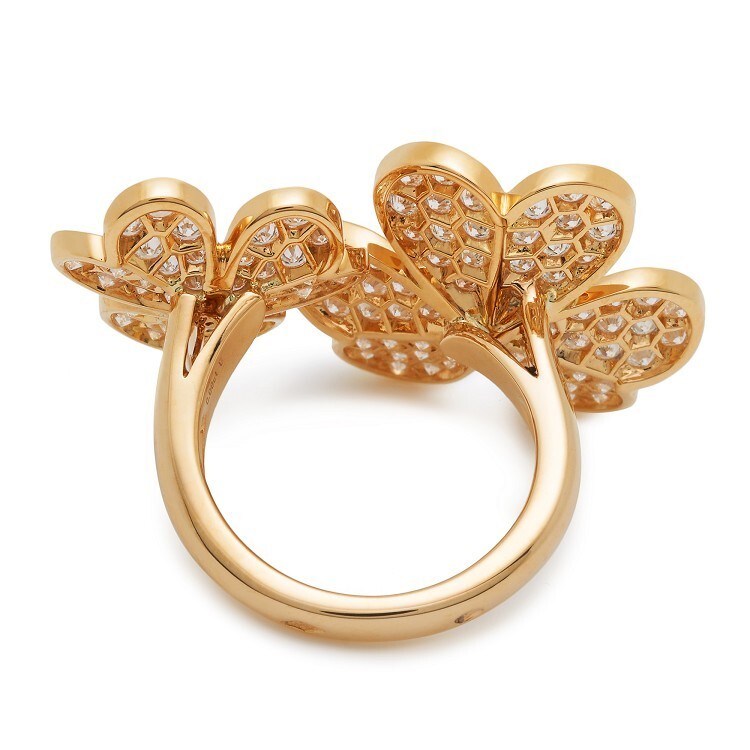 Van Cleef & Arpels Frivole jewelry featuring a gold ring with sparkling diamond flowers