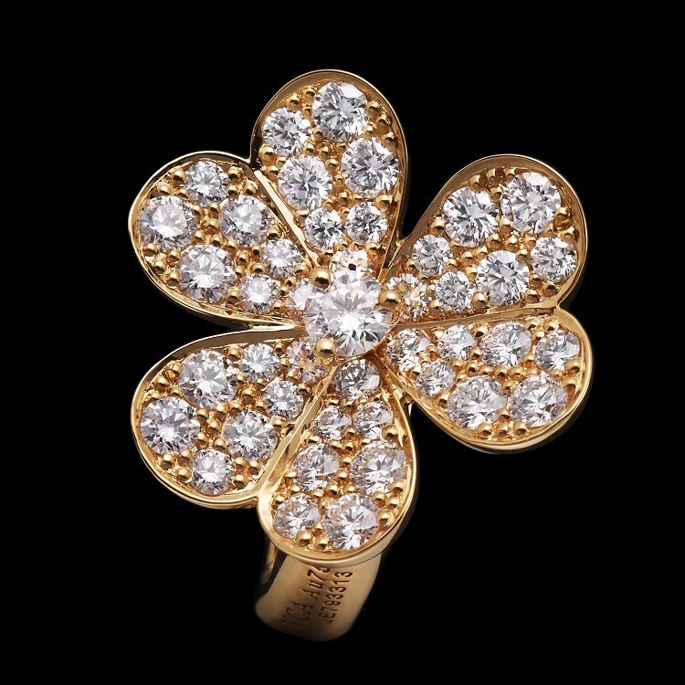 Elegant Frivole earrings by Van Cleef & Arpels, designed with a single diamond flower