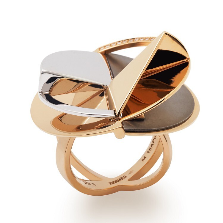 The Hermès Trajectoire ring from a different angle, revealing its multi-layered structure and polished finishes.