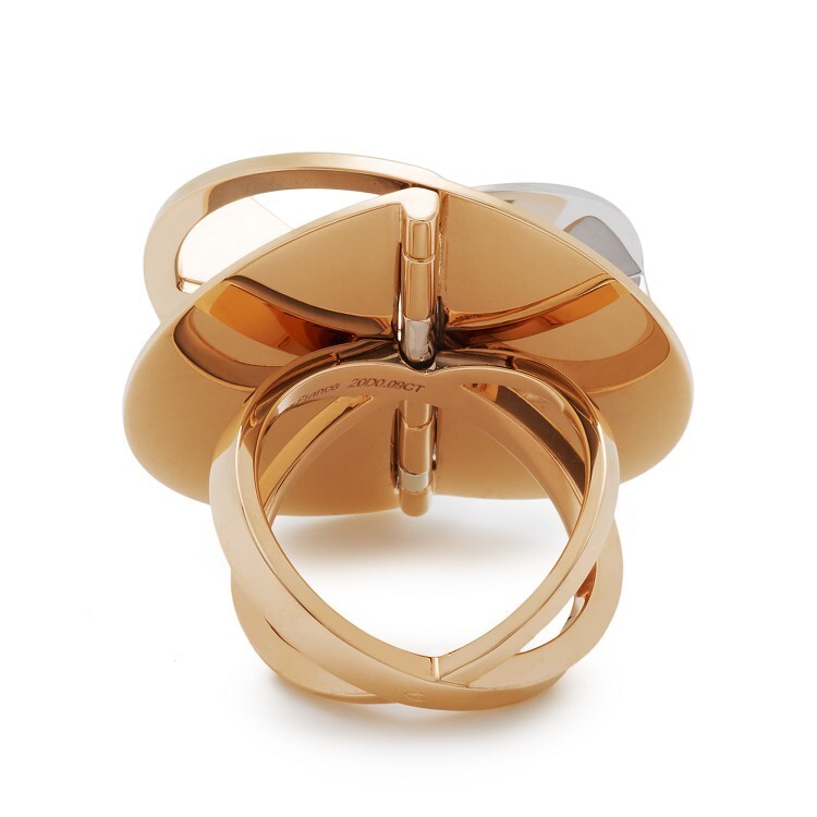 Side view of the Hermès Trajectoire ring, showcasing the innovative 'fold' design and the interplay of materials.