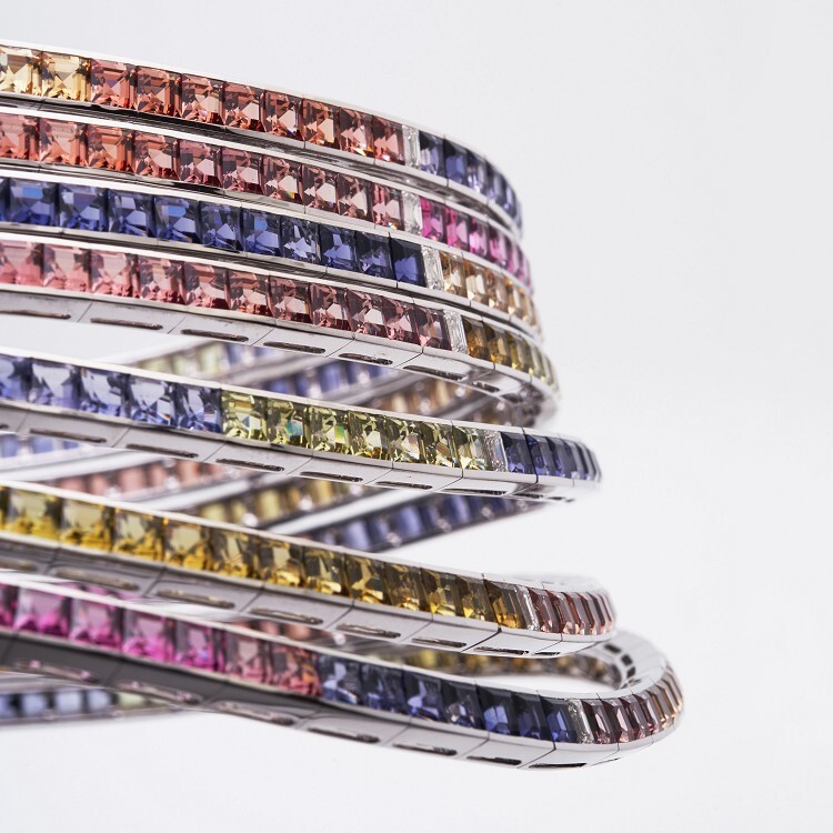 Macro view of the square step-cut gemstones in the Hermès Feux du Ciel necklace, illustrating their precise fit.