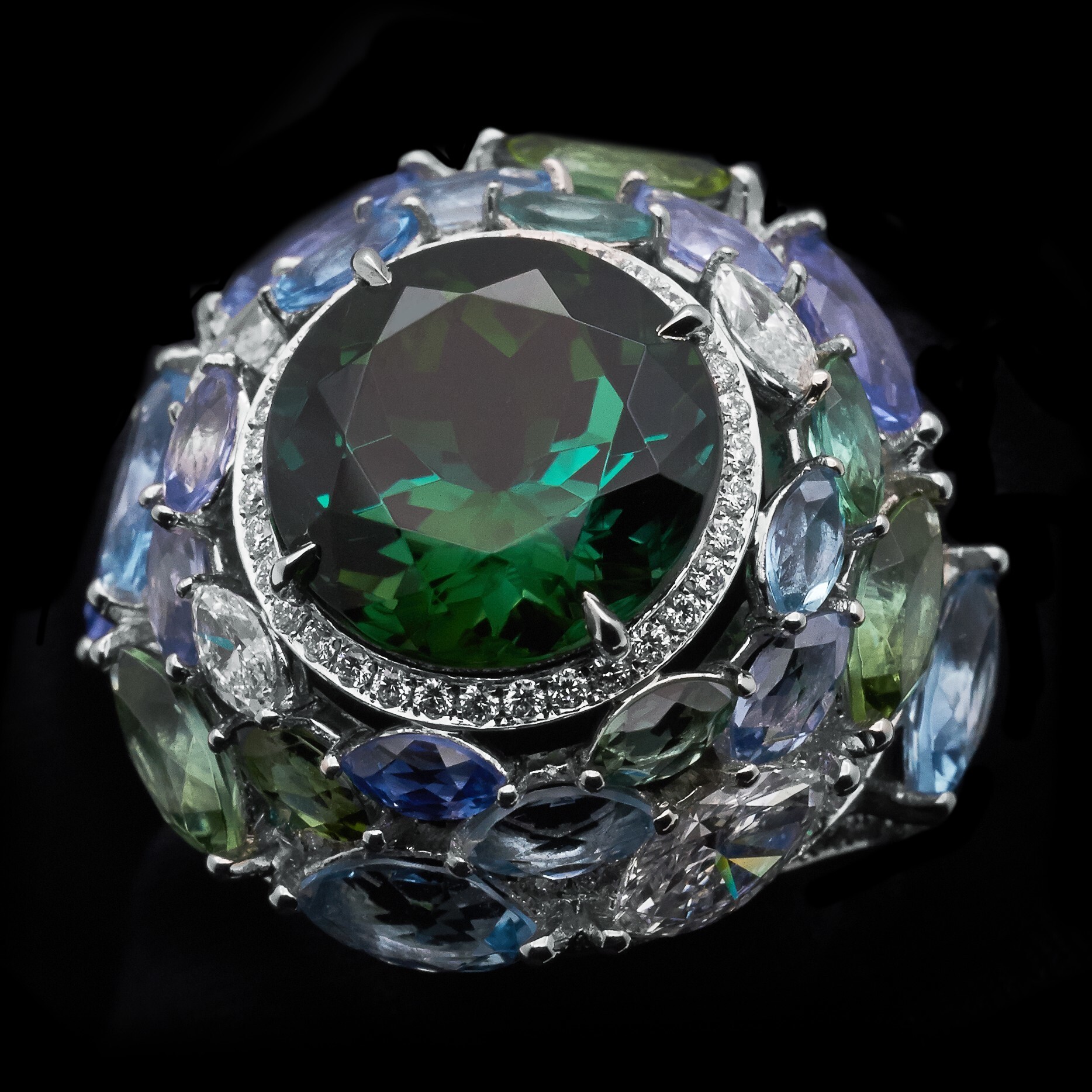 Overhead view accentuating the 'Fish Swirl' design of the Tiffany Blue Book ring with its rich teal color palette.