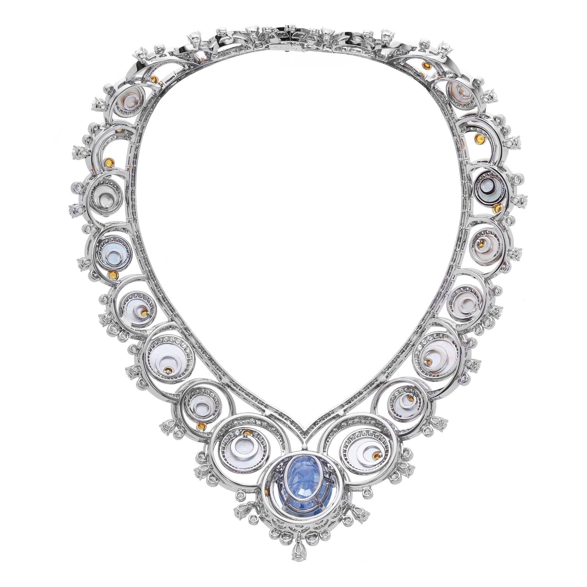 Macro shot of the Van Cleef & Arpels Engraved Sapphire Necklace, emphasizing the mother-of-pearl and diamond settings.