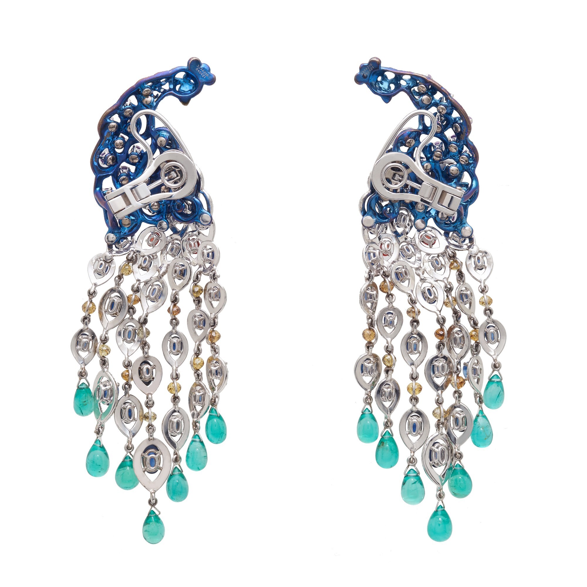 Close-up of Chopard Animal World Peacock earrings highlighting sapphires, amethysts, and white gold settings