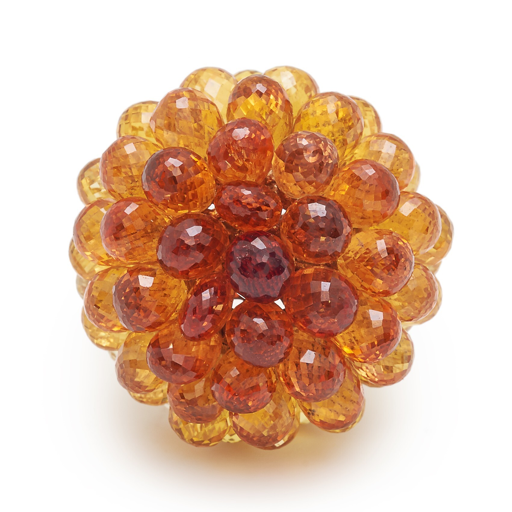 Angled shot of the Chopard Copacabana orange sapphire ring, emphasizing its voluminous design
