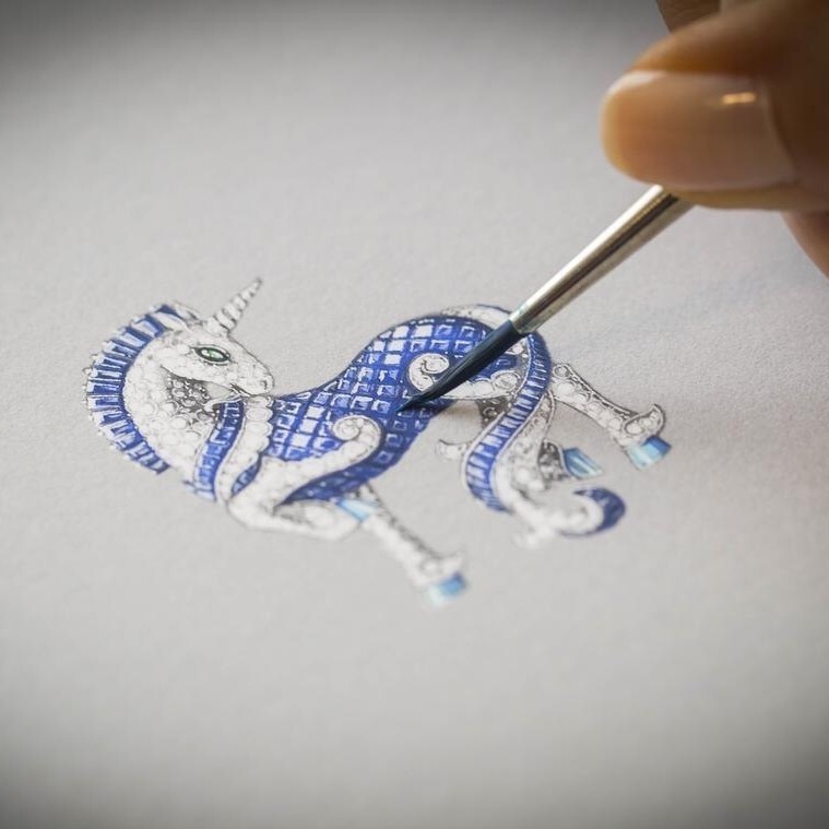 Detailed view of the Van Cleef & Arpels unicorn brooch, highlighting sapphire hidden-setting and diamond details
