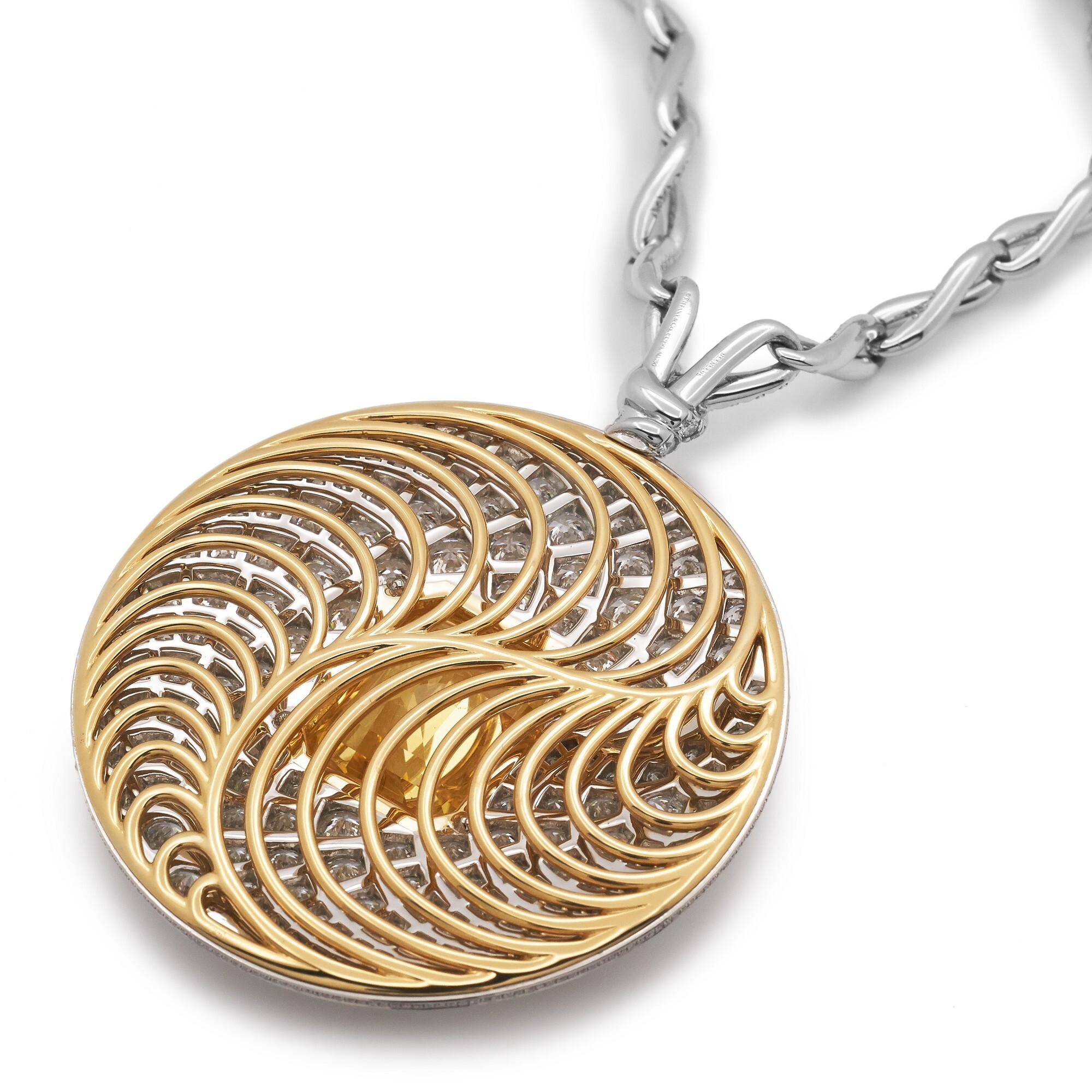 Close-up view of the Tiffany & Co. Blue Book necklace showcasing the radiant 22.11-carat yellow sapphire.