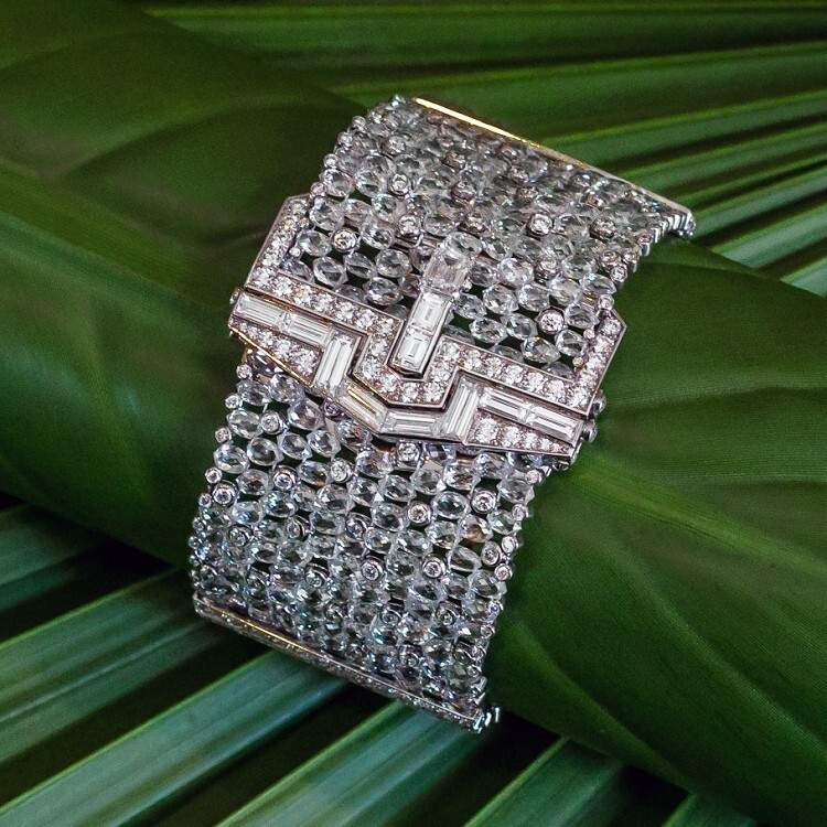 Close-up view of the Cartier Etourdissant Diamas bracelet, highlighting the luxurious setting of pear-shaped and baguette-cut diamonds on a platinum base.