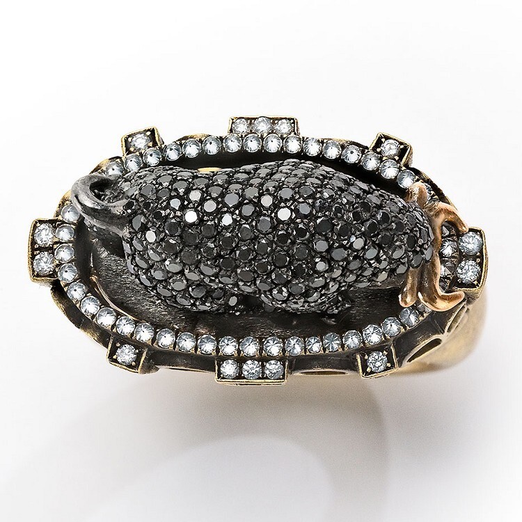 Side profile of the 'Bull and Bullfighter' ring, highlighting the bull's powerful form and the Colosseum base.