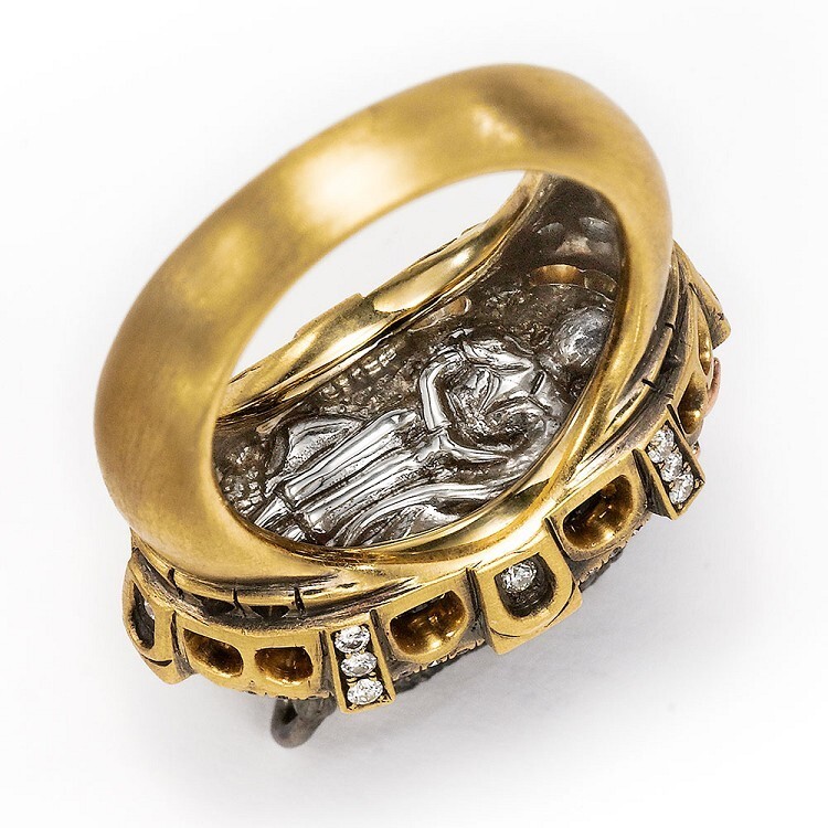 Overhead view of the 'Bull and Bullfighter' ring, emphasizing the placement of black and colorless diamonds.