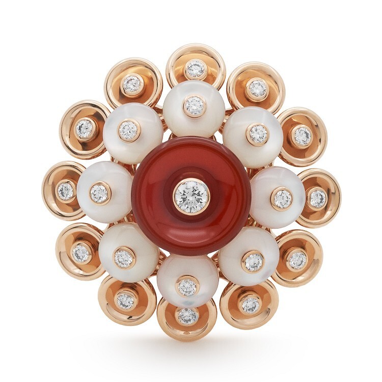 Close-up view of the Van Cleef & Arpels Bouton d'Or ring showcasing its exquisite craftsmanship and gemstone inlays.
