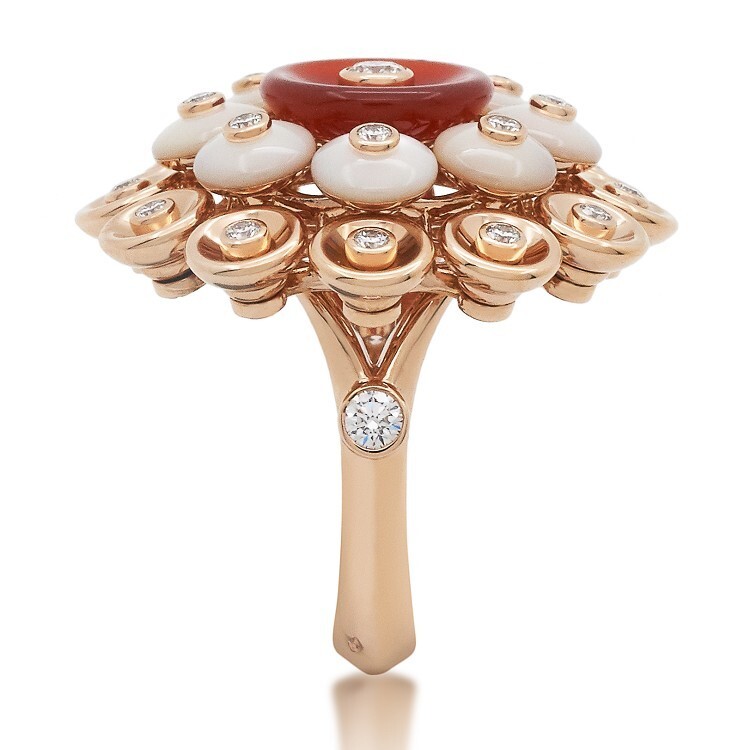 A Van Cleef & Arpels Bouton d'Or ring in rose gold adorned with precious stones.