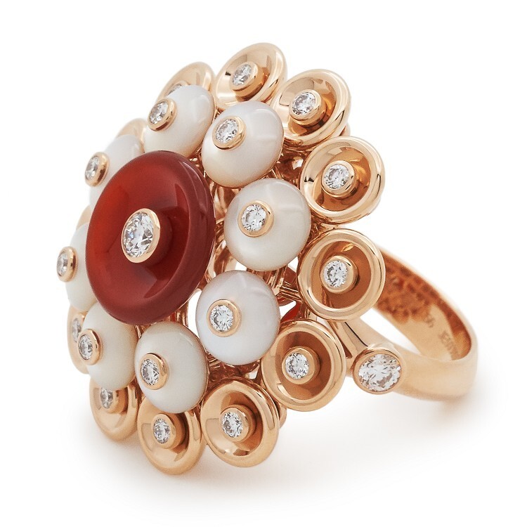 Detail shot of the rose gold Bouton d'Or ring from Van Cleef & Arpels, highlighting the 'buttercup' motif.
