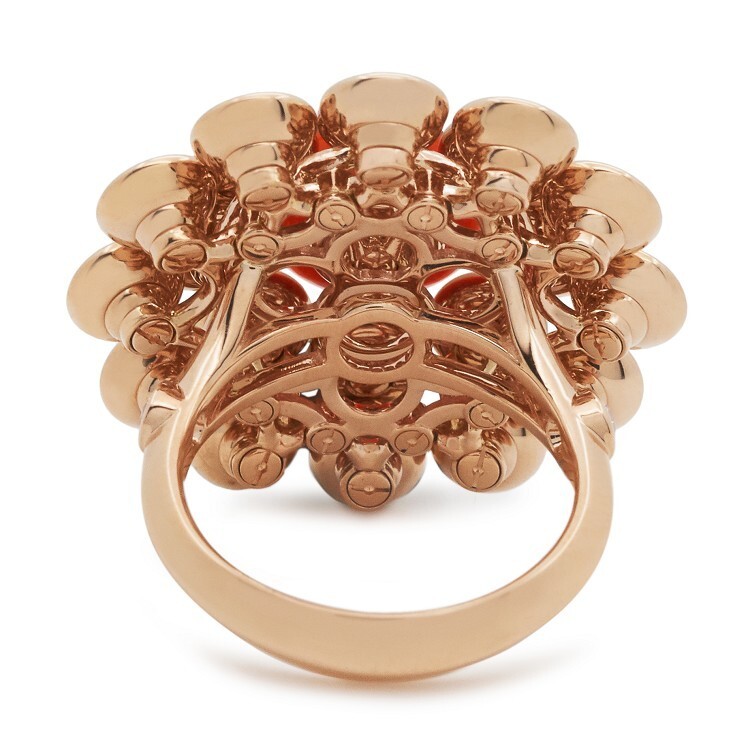The luxurious Van Cleef & Arpels Bouton d'Or ring from an angled perspective, revealing its detailed design.
