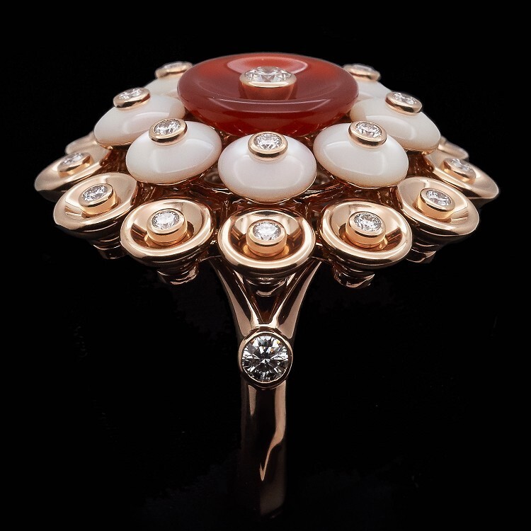 Fine jewelry design: Van Cleef & Arpels Bouton d'Or ring featuring a central diamond and rose gold elements.