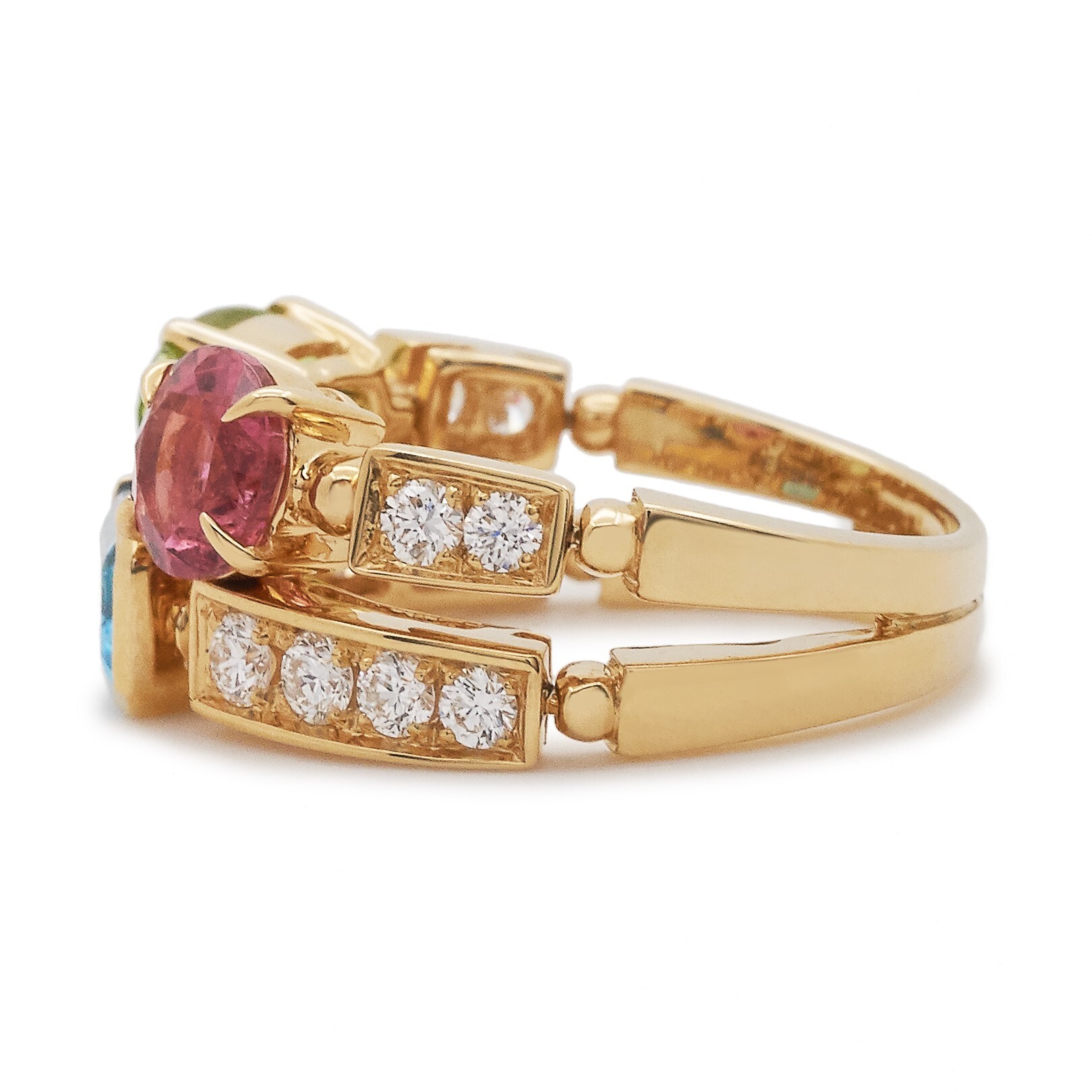 Detailed shot of the Bulgari Allegra Color ring's side profile, highlighting the staggered gemstone arrangement and gold craftsmanship.