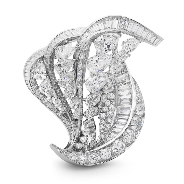 Close-up view of the De Beers Imaginary Nature brooch, highlighting the pear-cut and brilliant-cut diamonds.