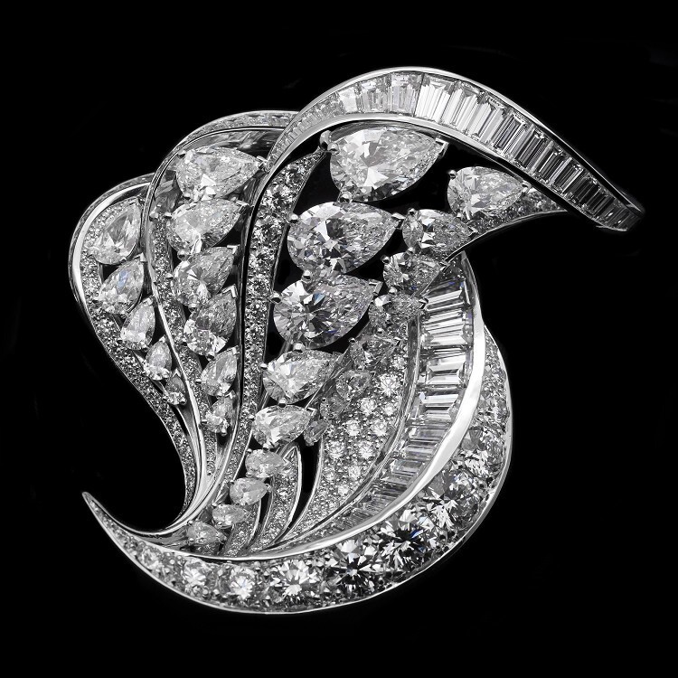 Detail of the De Beers Imaginary Nature diamond brooch, showcasing baguette-cut diamonds and intricate platinum work.