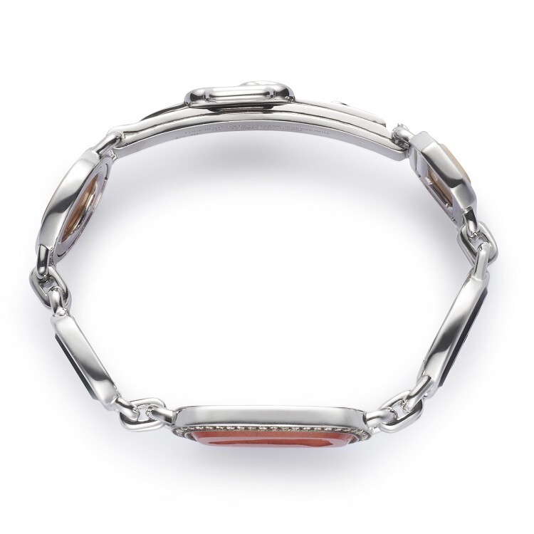 Close-up of the Hermès Chevauchée bracelet, highlighting the intricate intaglio carvings on various gemstones.