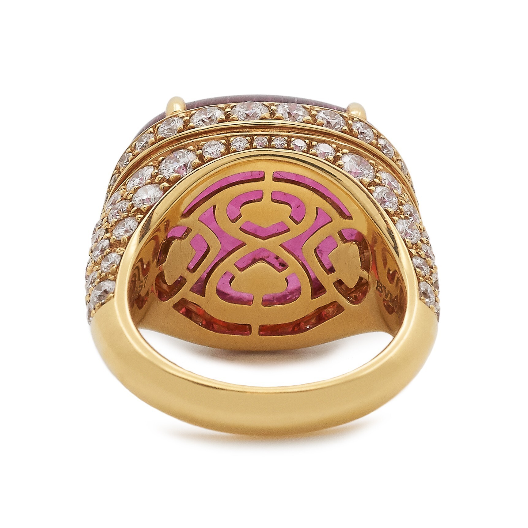 Angled shot of the Bulgari Mediterranean Eden ring, emphasizing the brilliant sparkle of the diamonds surrounding the central rubellite