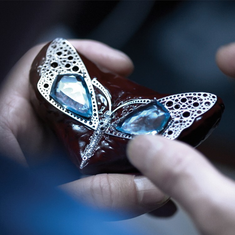 Detailed view of the Tiffany & Co. butterfly brooch, highlighting the delicate craftsmanship and the array of colorful gemstones.
