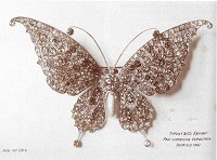 Close-up of the Tiffany & Co. Blue Book butterfly brooch showing the intricate setting of moonstones and tsavorites along the wing edges.