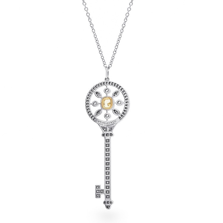 Various angles of the Tiffany Kaleidoscope Key Pendant, emphasizing its dazzling design and yellow diamond