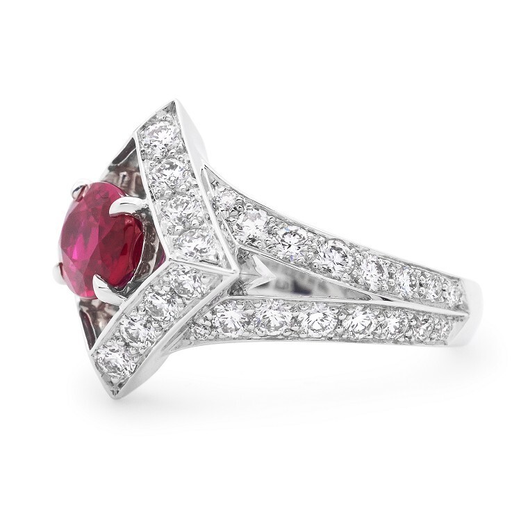 Angled shot of the Louis Vuitton Beau Rivage ring, emphasizing the brilliance of the oval ruby and surrounding diamonds.