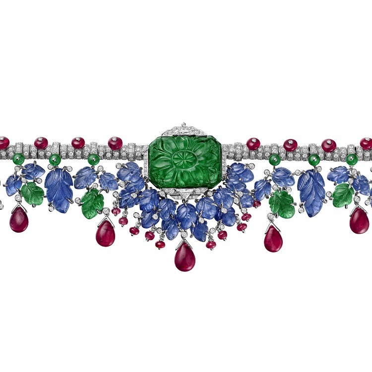 Close-up view of the Cartier Étourdissant Headband showcasing engraved sapphires, emeralds, and rubies intertwined with diamonds.