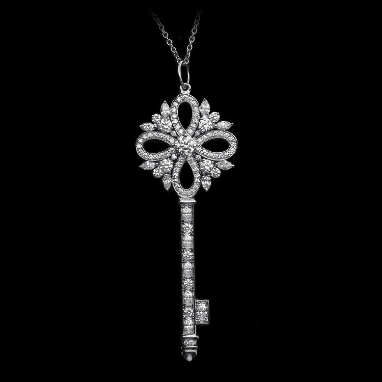 Close-up view of the Tiffany Victoria key pendant showcasing intricate diamond setting and floral design
