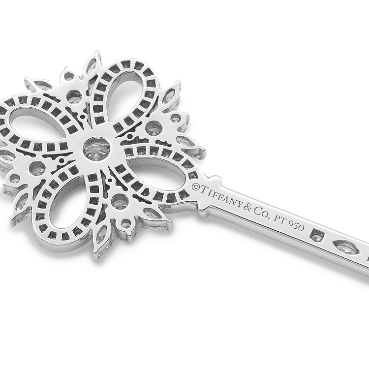Detailed shot of the diamond-set key handle and intricate key bit of the Tiffany Victoria pendant