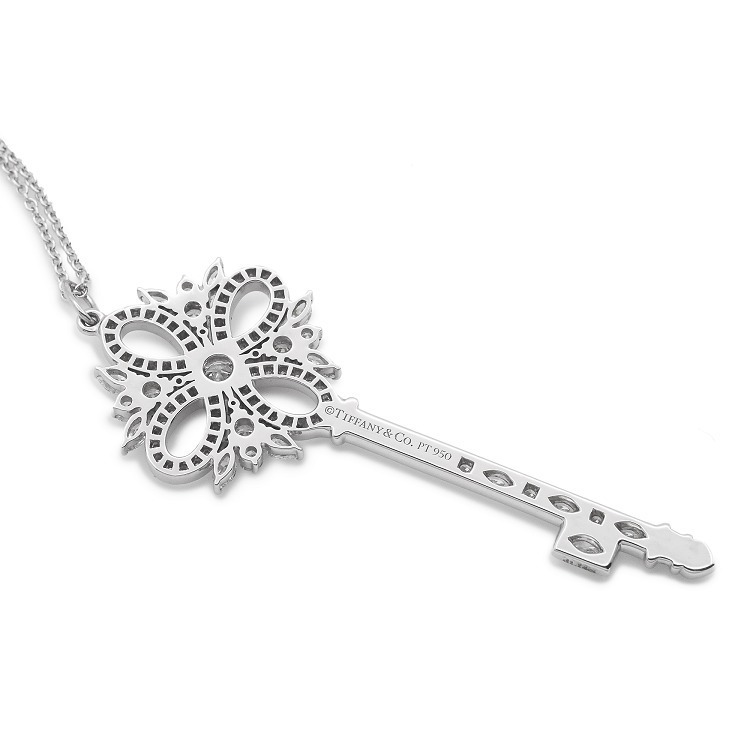 Angled display of the Tiffany Victoria key pendant highlighting platinum craftsmanship
