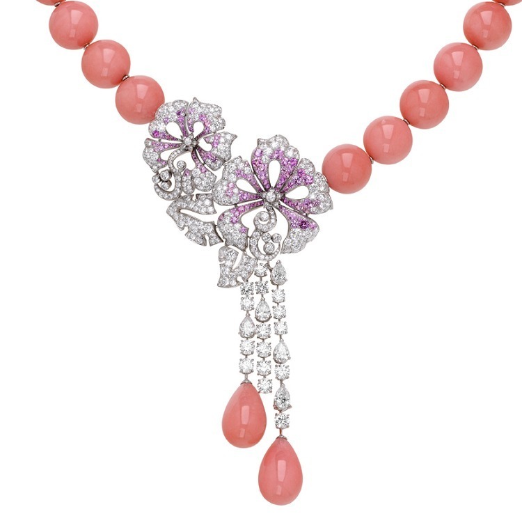 Close-up view of the Van Cleef & Arpels Hibiscus d'Opale necklace, highlighting pink sapphires, diamonds, and pear-shaped opals