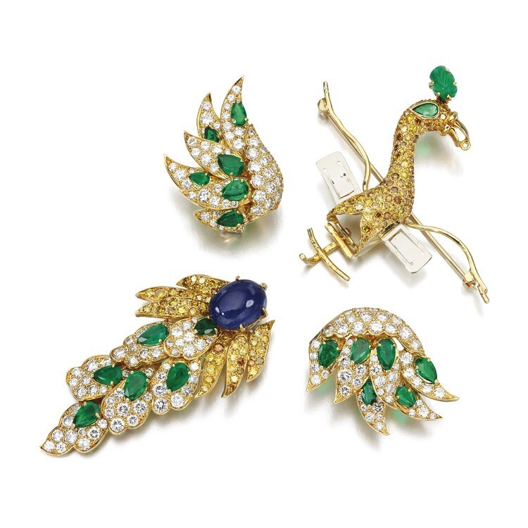 Detailed view of the Walska Briolette Diamond Brooch by Van Cleef & Arpels, showing the vibrant emeralds and sapphires