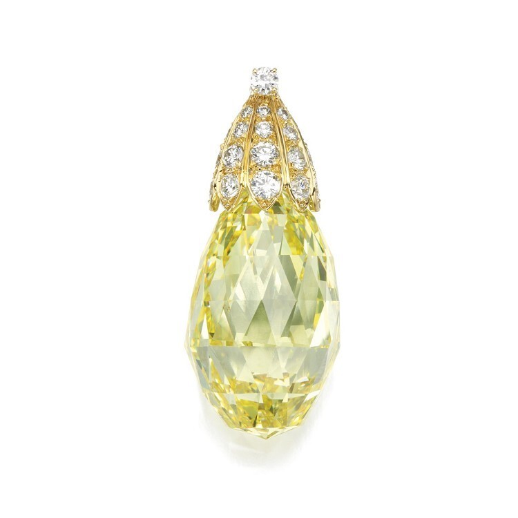 Artistic shot of the Van Cleef & Arpels phoenix brooch, showcasing its multi-functional design elements