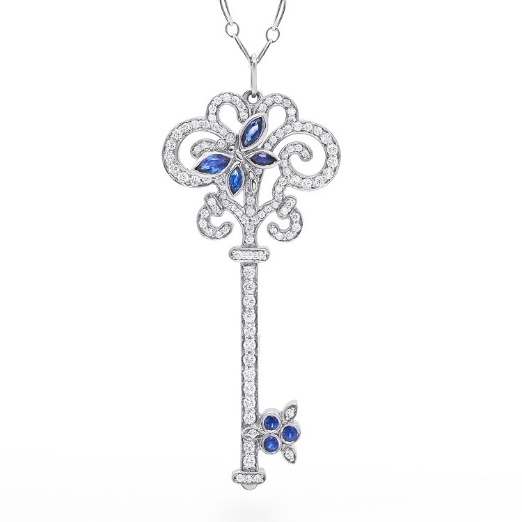 Close-up of the intricate sapphire dragonfly detail on a Tiffany Enchant Collection key pendant